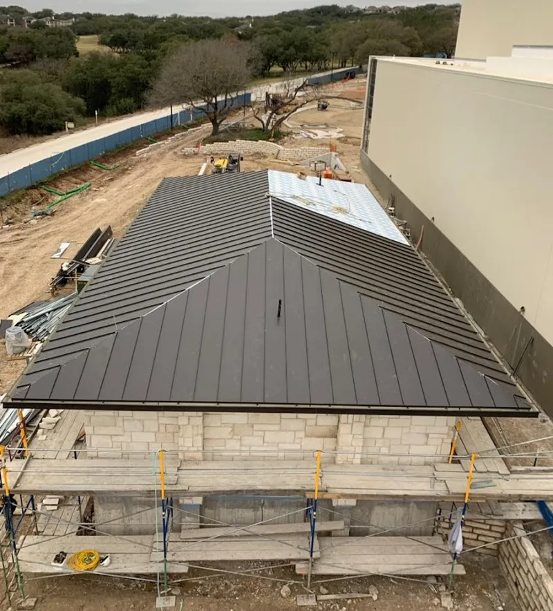 Metal roof new construction with scaffolding in Forest